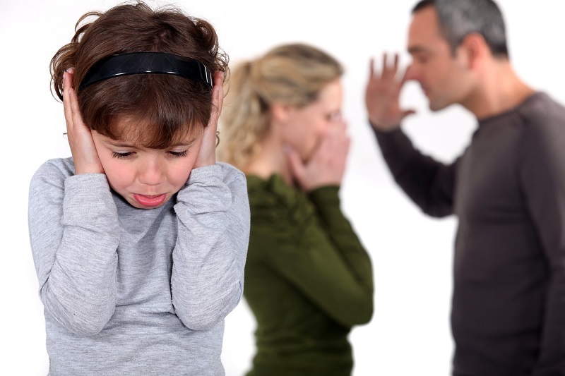 young-girl-trying-to-block-out-the-sound-of-her-parents-arguing (1).jpg